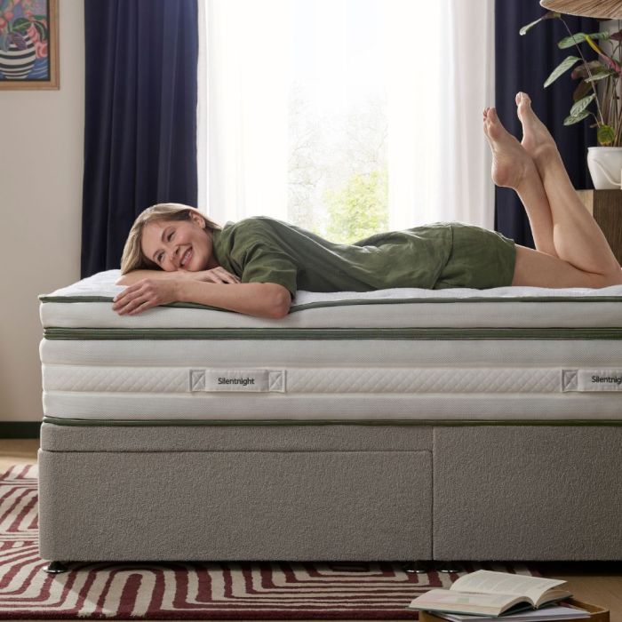 A happy person lying on a Silentnight Airmesh 3000 Box Top Mattress