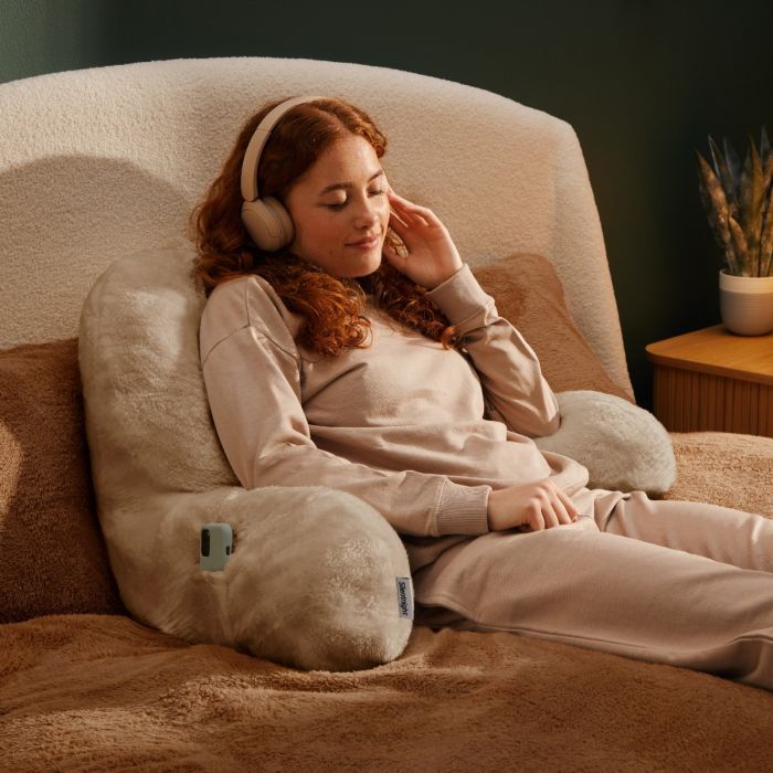 Person relaxing with Silentnight cosy cuddles usb heated pillow