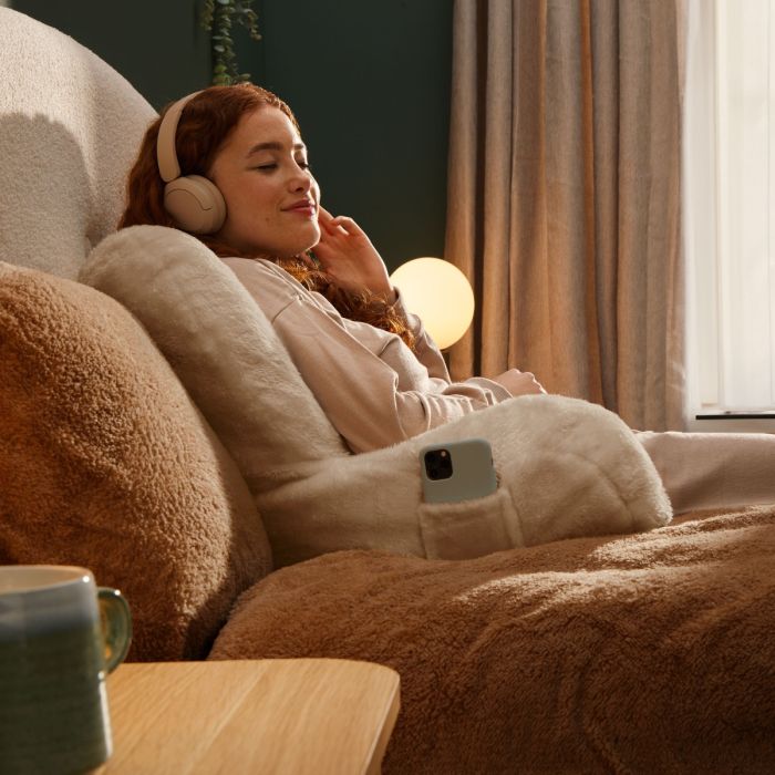 Person cosy with heated pillow