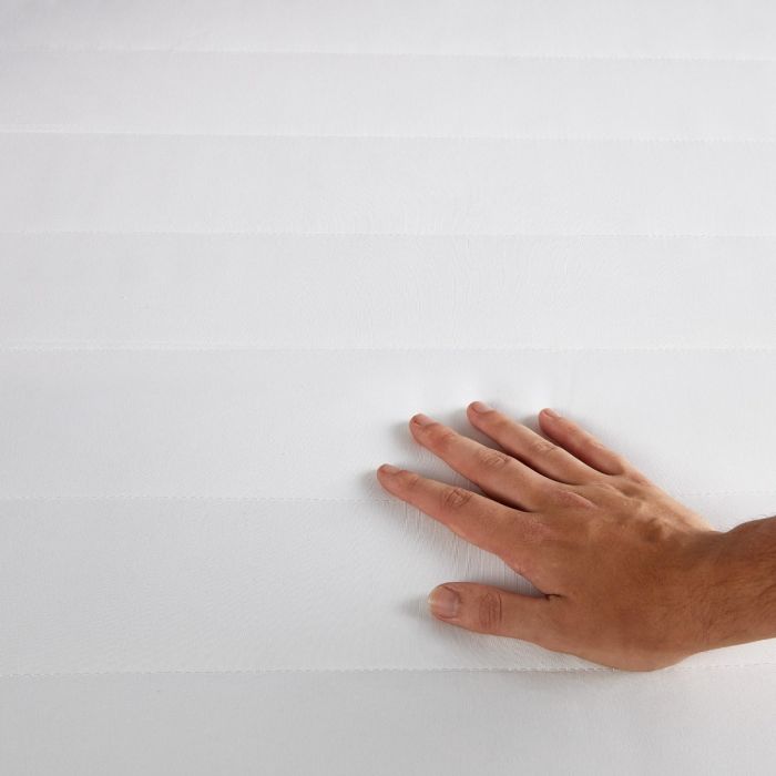 A persons hand on top of the Silentnight Anti-Allergy Mattress Protector 
