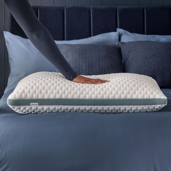 a hand showing how plump this pillow is